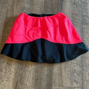 Women’s Small Tail Black and Orange Tennis Skirt.